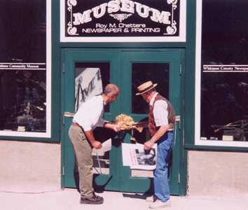 Mayor Michael Echanove and Bob West cut the ribbon to officially re-open the Museum to the public on Palouse Day 2003.